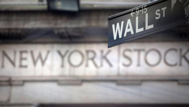 FILE PHOTO: A Wall Street sign outside the New York Stock Exchange