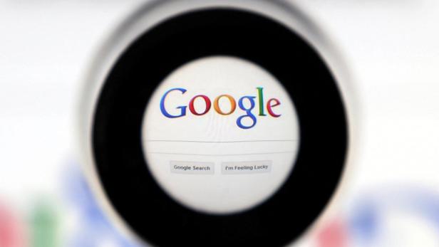 FILE PHOTO: A Google search page is seen through a magnifying glass in this photo illustration taken in Brussels