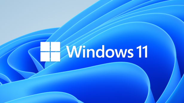 Das Windows 11-Logo vor einem abstrakten, blauen Hintergrund.