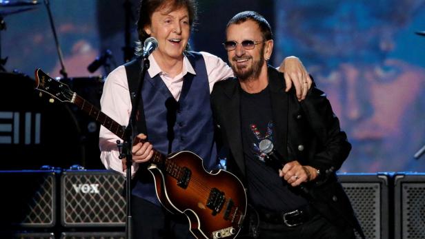 FILE PHOTO: Paul McCartney and Ringo Starr perform during the taping of "The Night That Changed America: A GRAMMY Salute To The Beatles"  in Los Angeles