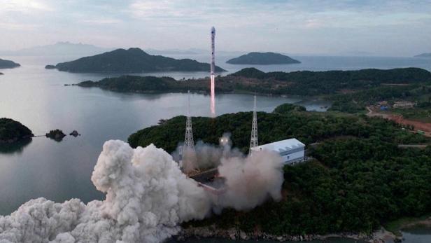 FILE PHOTO: A still photograph shows what appears to be North Korea's new Chollima-1 rocket being launched in Cholsan County