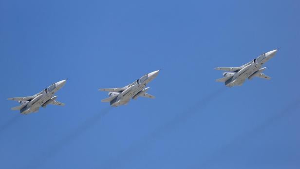 FILE PHOTO: Sukhoi Su-24 bombers fly in formation over the Red Square during the Victory Day parade in Moscow