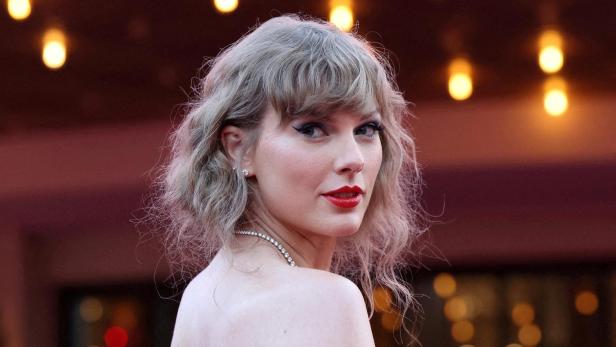 FILE PHOTO: Taylor Swift attends a premiere for Taylor Swift: The Eras Tour in Los Angeles