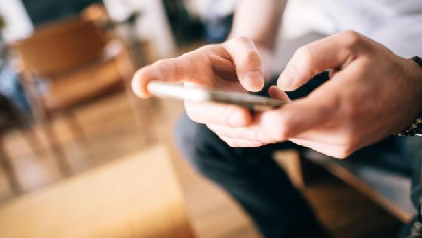 male hands using smartphone male hands using smartphone