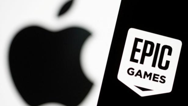 FILE PHOTO: Smartphone with Epic Games logo is seen in front of Apple logo in this illustration