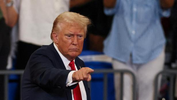 FILE PHOTO: Republican presidential nominee and former U.S. President Donald Trump and his running mate JD Vance hold a campaign rally in Atlanta, Georgia