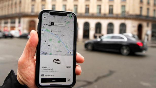 FILE PHOTO: A photo Illustration shows the Uber application on a mobile phone in in central Paris