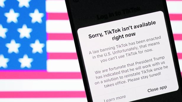 Illustration shows the U.S. flag and TikTok app with the message "Sorry, TikTok isn't available right now\