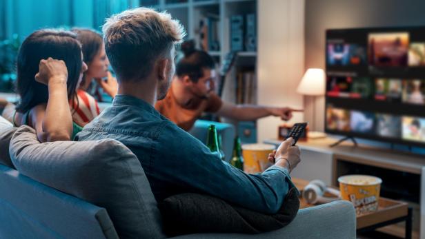 Friends watching movies together at home Friends watching movies together at home