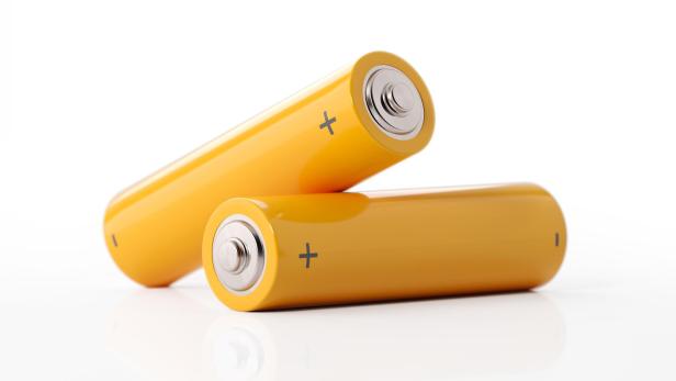 AA Size Two Yellow Batteries On White Background