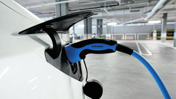 FILE PHOTO: A Tesla electric vehicle is being charged in a supermarket FILE PHOTO: A Tesla electric vehicle is being charged in a supermarket