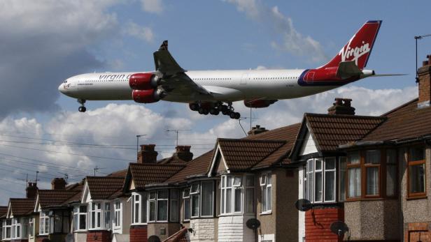 A Virgin Atlantic aircraft comes in to land at Heathrow Airport, in London in this file photo taken May 26, 2009. Delta Air Lines Inc said it was buying a 49 percent stake in Virgin Atlantic for $360 million on Tuesday. The sale came after sources familiar with the matter said Delta, the second-largest U.S. airline by operating revenue after United Continental Holdings, wants to gain access to Virgin&#039;s landing rights at London&#039;s Heathrow airport. REUTERS/Luke MacGregor/Files (BRITAIN - Tags: TRANSPORT BUSINESS)