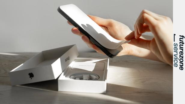 New iphone 14 pro unboxing, unpacking from box, peeling off screen protector, editorial use