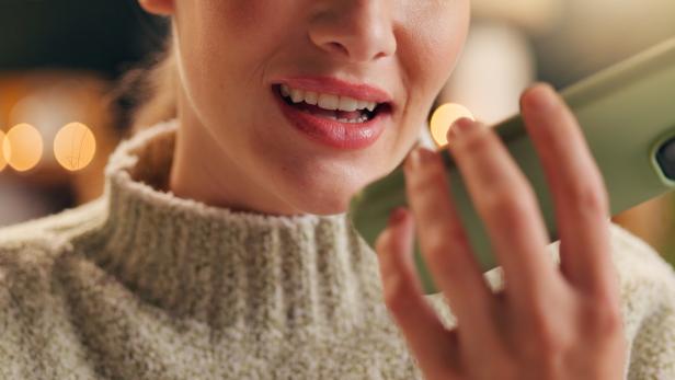 Woman, smartphone and home talking for voice note, recording and speaker or mic on mobile app or tech. Phone call, communication and audio message in apartment, voicemail and speech conversation