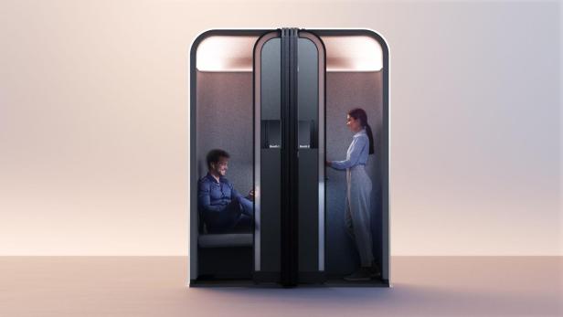 Zweiteiliger Pod mit Sitz- und Stehplatz, jeweils von einer Person genutzt, beleuchtet.