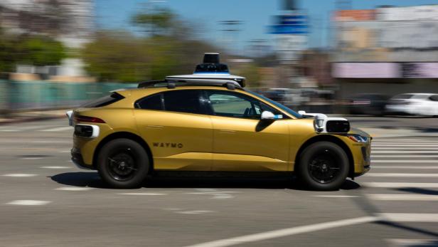 Waymo Robotaxi in Gold