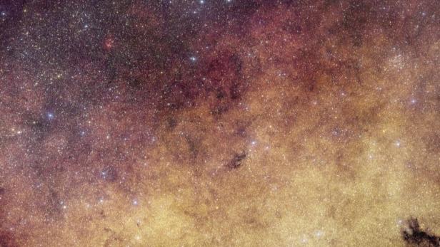 Ein Sternenfeld der Milchstraße steht für das frühe Universum und den Big Bang.