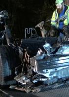 The remains of a Tesla vehicle are seen after it crashed in The Woodlands, Texas