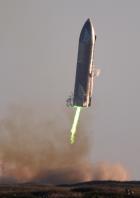 FILE PHOTO: SpaceX's first super heavy-lift Starship SN8 rocket prepares to land after it launched from their facility on a test flight in Boca Chica, Texas