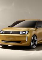 Der goldfarbene Volkswagen ID.Every1 steht vor einem neutralen Hintergrund.
