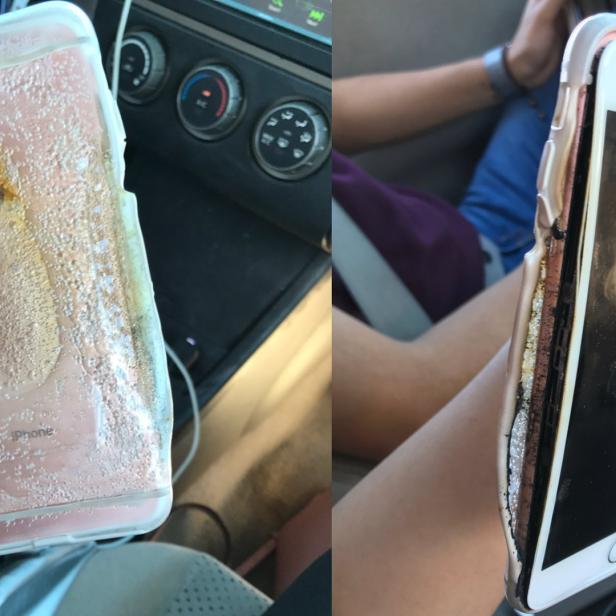 Ein beschädigtes iPhone mit einer geschmolzenen, rosafarbenen Hülle wird in einem Auto gehalten.