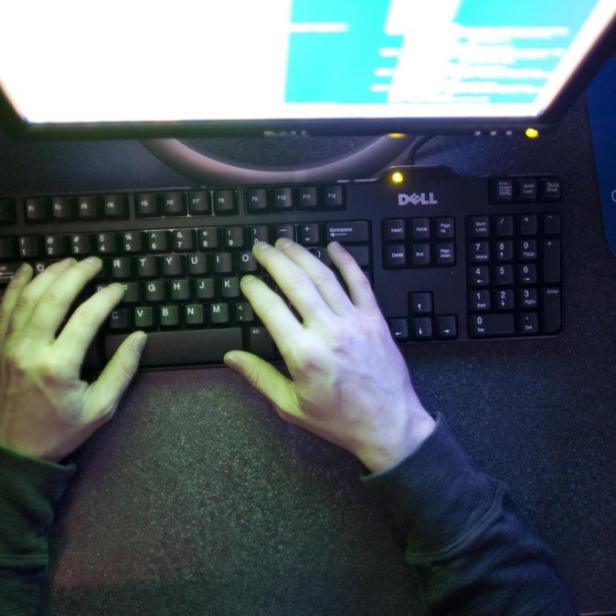 U.S. Marine Sergeant Michael Kidd works on a computer at ECPI University in Virginia Beach, Virginia, February 7, 2012. Cyberspace was a hobby for Kidd before he joined the Marines in 2003, but he hopes to make it his new battlefield after suffering debilitating injuries in Iraq. At the naval air station in Virginia Beach, Virginia, the 26-year-old from Williamsburg is retraining to fight cyber threats, one of a number of wounded warriors transitioning to non-traditional combat fields in order to continue serving the United States&#039; defense needs. Picture taken February 7, 2012. REUTERS/Samantha Sais (UNITED STATES - Tags: MILITARY EDUCATION)