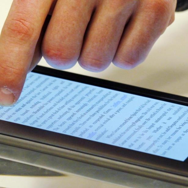 Ben VanderWerp demonstrates the features of a Nook e-reader for a customer at a Barnes and Noble store in Boston, March 18, 2011. Publishers are adapting to rising sales of e-books, and the popularity of smart phones and tablets such as the iPad. The retail landscape has changed with Amazon becoming the dominant seller of books while countless book stores go the way of video rental stores. America&#039;s No. 2 book store chain, Borders, is bankrupt. Some authors have dropped their publishers entirely, self-publishing online and using social media to connect with readers. Picture taken March 18, 2011. To match Special Report PUBLISHING/EBOOKS/ REUTERS/Brian Snyder (UNITED STATES - Tags: MEDIA BUSINESS SCI TECH)