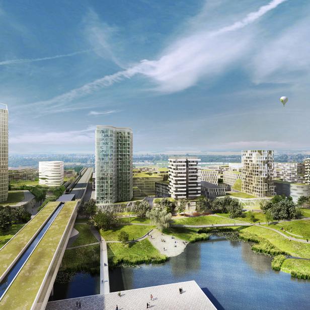 Eine moderne Stadtlandschaft mit Hochhäusern, einem See und einem begrünten Kanal.