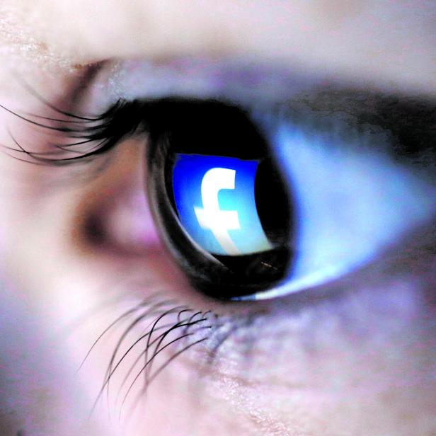 FILE PHOTO: A picture illustration shows a Facebook logo reflected in a person's eye, in Zenica