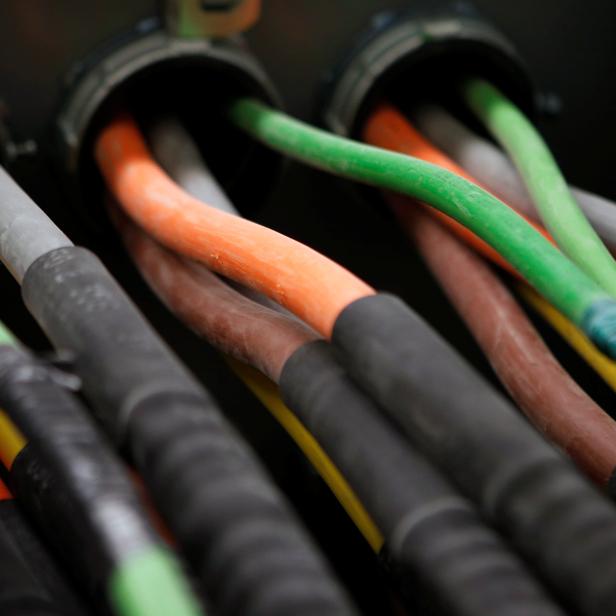 FILE PHOTO: Fiber optic cables carrying internet providers are seen running into a server room at Intergate.Manhattan, a data center owned and developed by Sabey Data Center Properties, during a tour of the facility in lower Manhattan, in New York