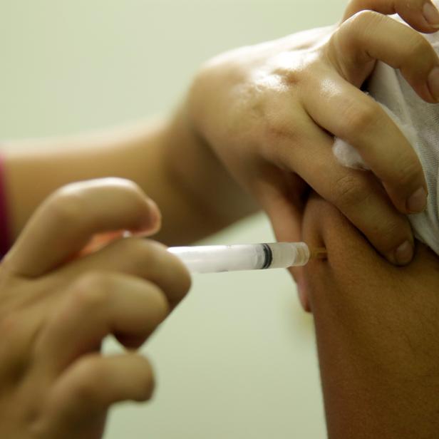 A woman is vaccinated during a campaign of vaccination against yellow fever  in Rio de Janeiro