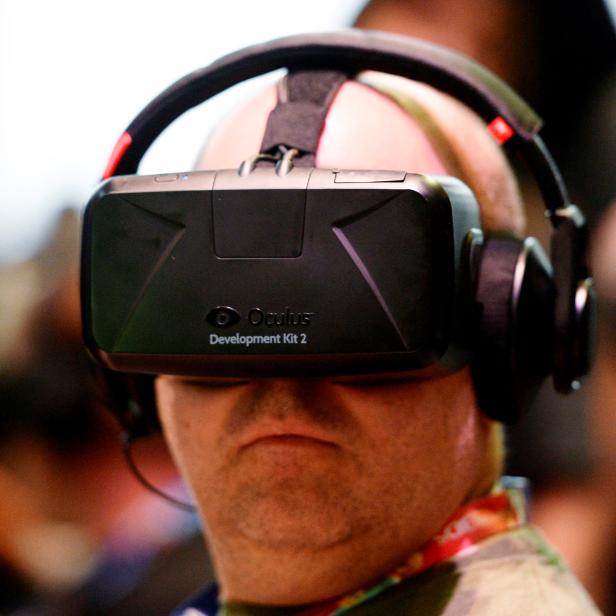 FILE PHOTO - Attendee tries Oculus Rift Development Kit 2 headset at Electronic Entertainment Expo in Los Angeles