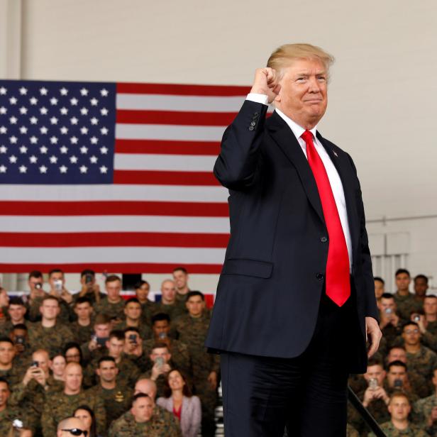 U.S. President Donald Trump pumps his fist after speaking at Marine Corps Air Station Miramar in San Diego, California