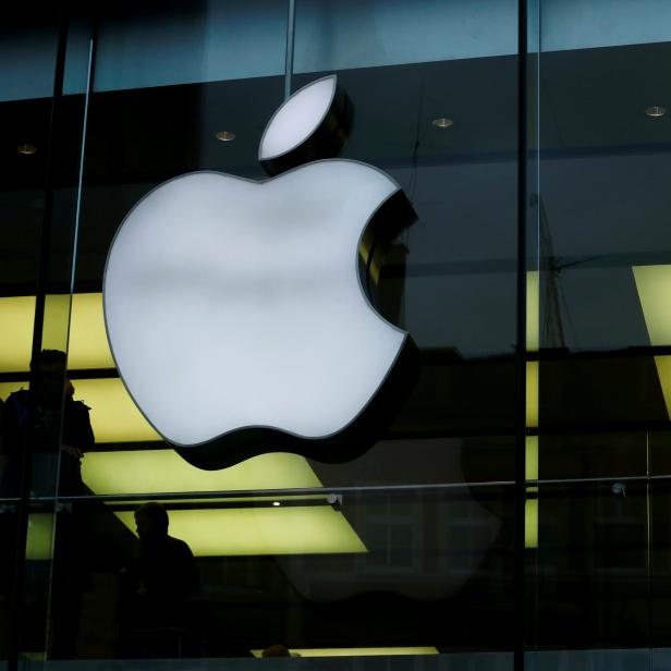 FILE PHOTO: Activists from the anti-globalisation organisation Attac protest against alleged tax evasion by Apple company in front of an Apple store in Frankfurt