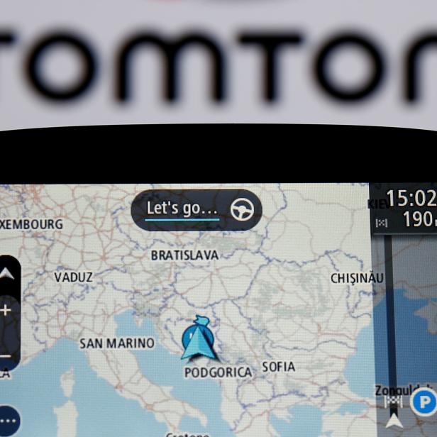 FILE PHOTO: TomTom navigation are seen in front of TomTom displayed logo in this illustration taken