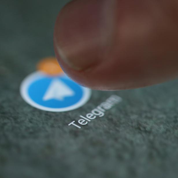 The Telegram app logo is seen on a smartphone in this illustration