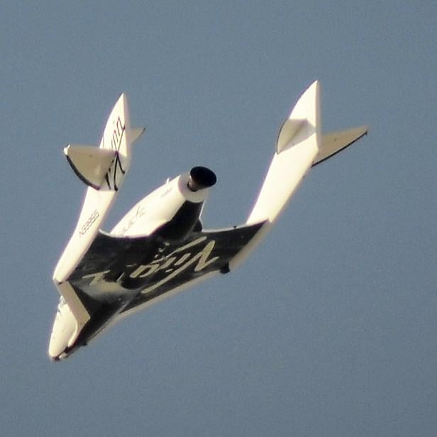 File photo of Virgin Galactic's SpaceShipTwo flies over the Mojave Desert shortly before successfully completing a test flight that broke the sound barrier