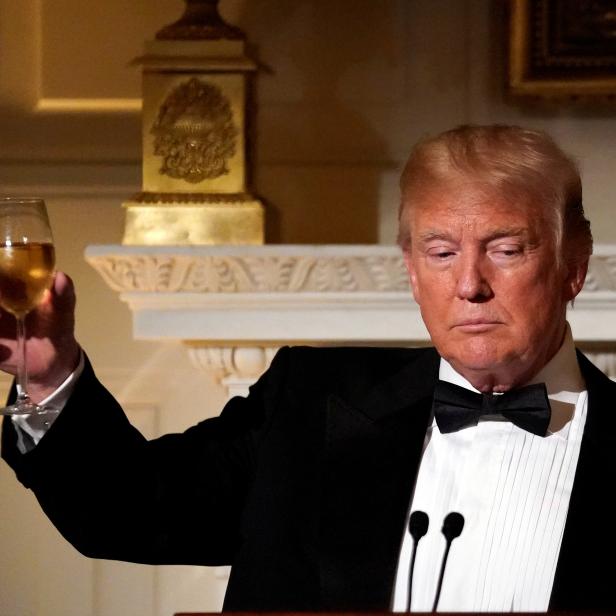 U.S. President Donald Trump toasts French President Emmanuel Macron (not pictured) during a State Dinner at the White House in Washington, U.S.