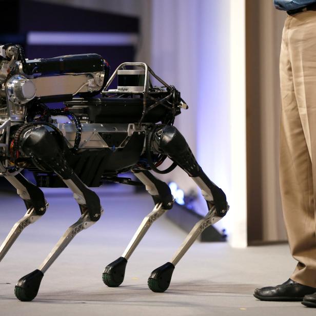 Boston Dynamics CEO and Founder Marc Raibert demonstrates his company's SpotMini robot at SoftBank World 2017 conference in Tokyo, Japan