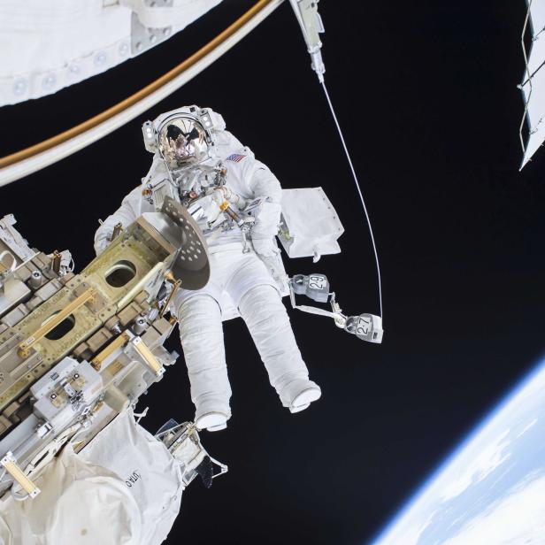 Expedition 46 Flight Engineer Tim Kopra performs a spacewalk outside the International Space Station in this NASA handout photo