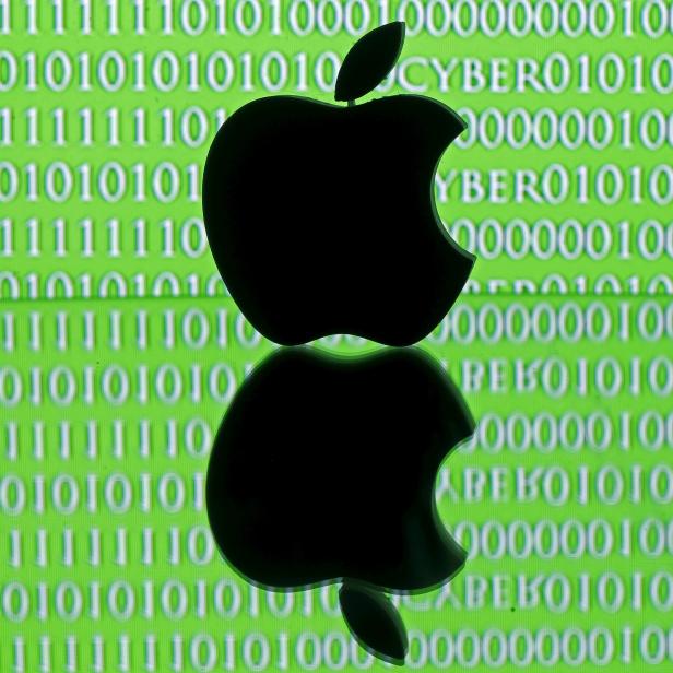 Picture illustration of a 3D printed Apple logo in front of a displayed cyber code