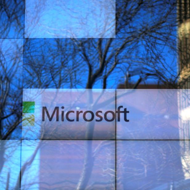 FILE PHOTO: An advertisement is played on a set of large screens at the Microsoft office in Cambridge