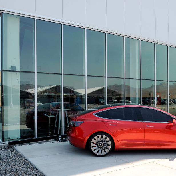 FILE PHOTO: A prototype of the Tesla Model 3 on display in front of the factory in Sparks