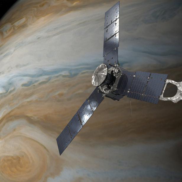 NASA handout of an illustration depicting the U.S. space agency's Juno spacecraft in orbit above Jupiter's Gread Red Spot.