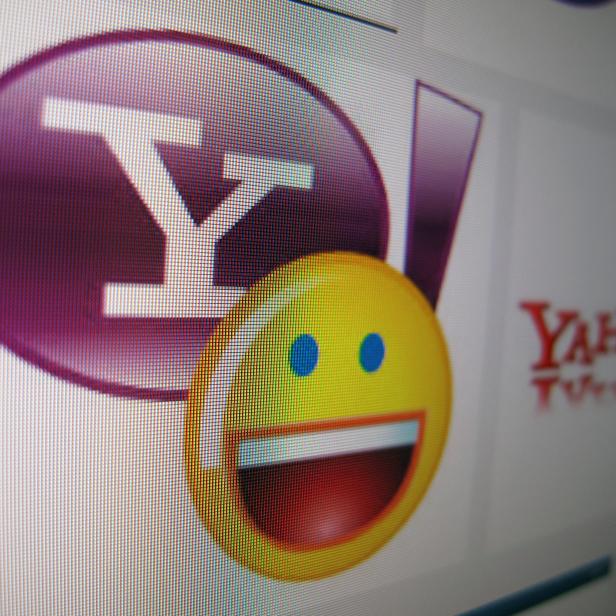 Photo illustration of a Yahoo messenger logo displayed on a monitor