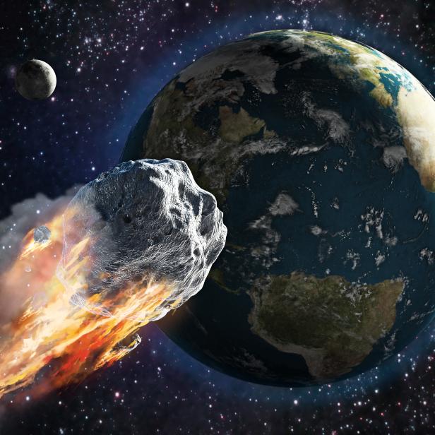Burning asteroid moving through the Earth