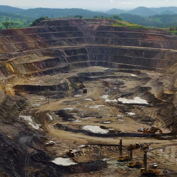 FILE PHOTO: Excavators and drillers at work in an open pit at Tenke Fungurume, a copper and cobalt mine northwest of Lubumbashi in Congo's copper-producing south