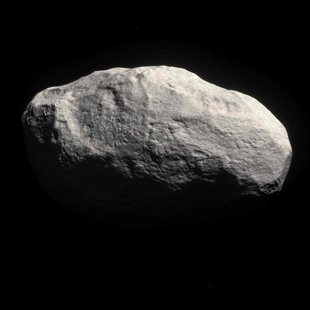 Ein Asteroid im Weltraum, beleuchtet von der Sonne.