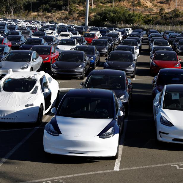 A parking lot of predominantly new Tesla Model 3 electric vehicles is seen in Richmond