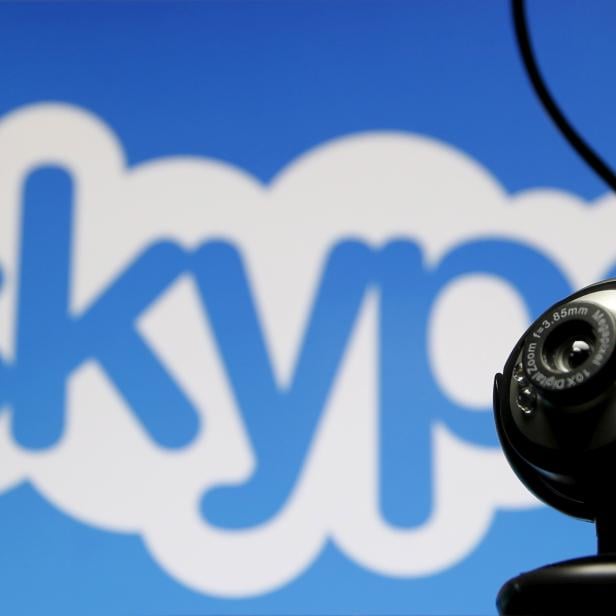 FILE PHOTO: A web camera is seen in front of a Skype logo in this photo illustration taken in Zenica